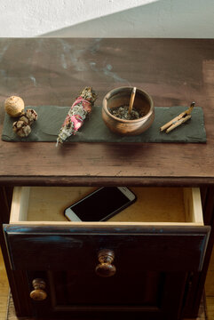 Incense smolders in a pottery on the table 