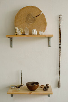 Incense smolders in a pottery on the shelf 
