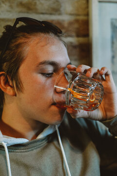  Young man in a Italian bar drinking coctail