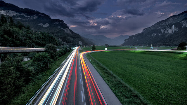 Speedy light trails in mountainous landscape