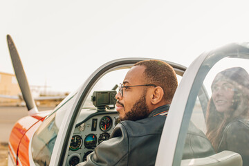 Young couple ready to take a flight in a small plane