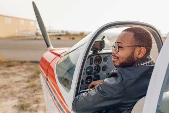Young couple ready to take a flight in a small plane