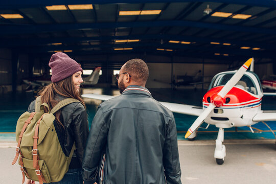 Young couple ready to take a flight in a small plane