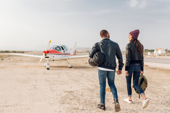 Young couple ready to take a flight in a small plane