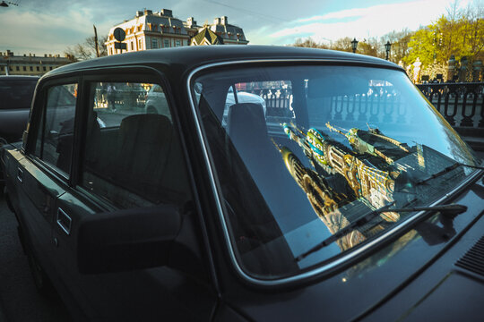 Car with the reflection of the church