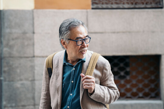 Happy Asian Man Walking in the City
