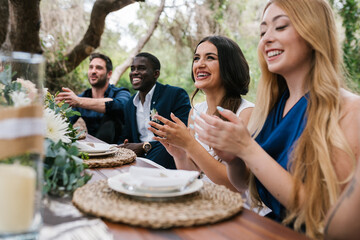 Couple on their wedding day with friends