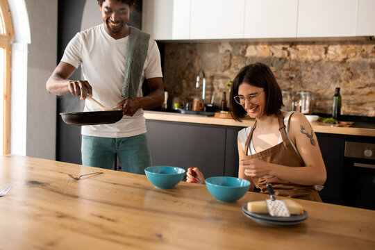 Boyfriend serving food to his girlfriend