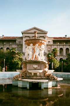 Vintage fountain in old hotel with a neo-classic architecture style