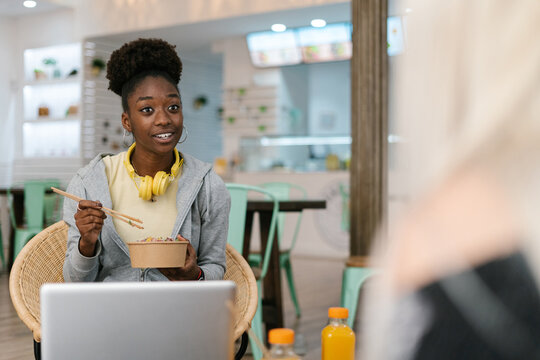 Black woman talking to an anonymous friend 