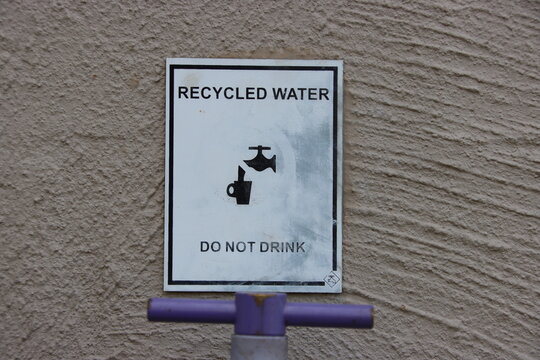 Smudged And Fading Recycled Water Sign, Cranbourne East, Melbourne, Victoria, Australia.