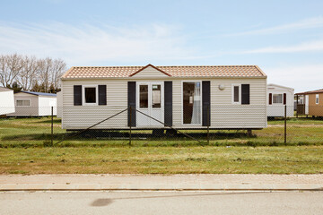 Modern mobile home behind fence