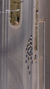 Group of road cyclists racing fast