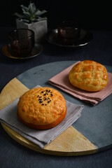 freshly baked Hong Kong Macau butter crispy skin polo bun in dark background pastry halal menu