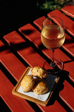 cheese puff and glass of wine