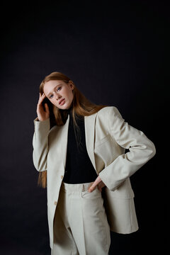 portrait red hair woman model in business suit