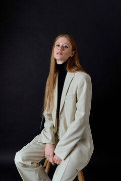 portrait red hair woman model in business suit