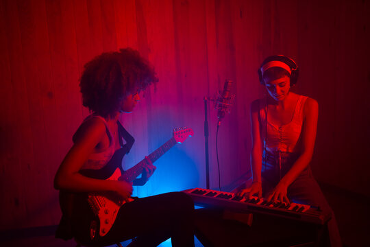 Female Musician Playing Music In The Studio.