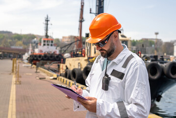 Inspector doing inspaction of ship in port