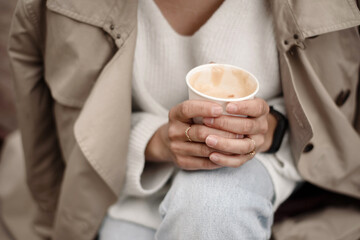 Woman holding cup of coffee