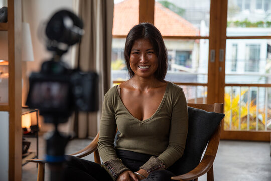 Yoga teacher teaching an online class
