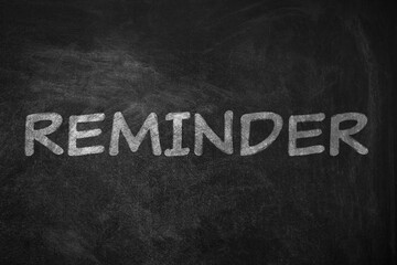 Obraz premium Word REMINDER written on blackboard. Don't forget