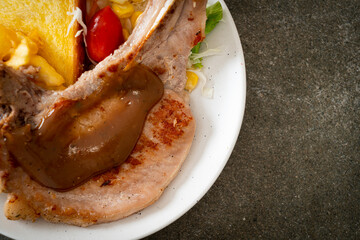 pork chop steak with chips and mini salad