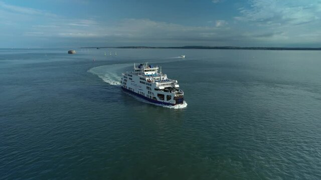 Wightlink Ferry Cruising Across Calm Sea In The Isle Of Wight, UK. aerial