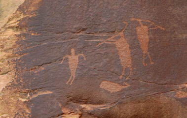 ancient  native american hunter petroglyphs  in shay canyon near canyonlands national park, utah