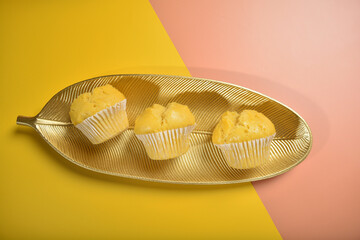 traditional local steam yellow cup cake huat kueh dessert with beautiful display in Pantone color background new asian halal dim sum menu