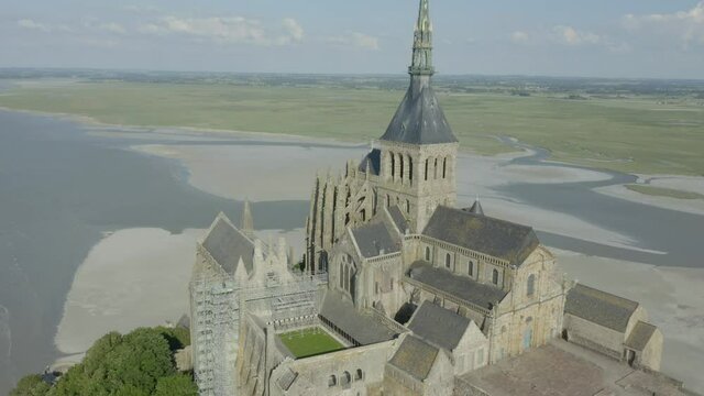 Aerial View Of Mont-Saint-Michel Abbey On A Rocky Islet With A View Of English Channel In France. - orbit