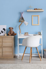 Interior of stylish children's room with modern workplace