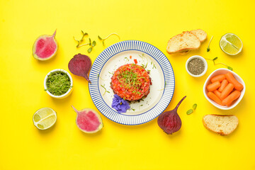 Composition with tasty tartare salad and ingredients on color background