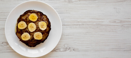 Homemade Banana Pancakes with Honey, top view. Flat lay, overhead, from above. Space for text.