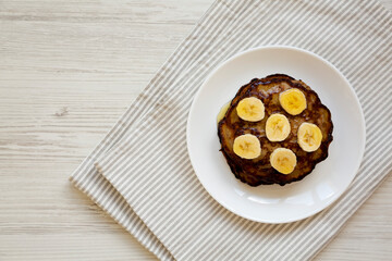Homemade Banana Pancakes with Honey, top view. Flat lay, overhead, from above. Space for text.