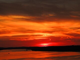 fiery sunset over the water in osage beach,  lake of the  ozarks, , missouri - obrazy, fototapety, plakaty