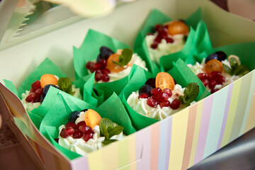 Natural cakes with cream and fruits. Sugar substitute. View from above