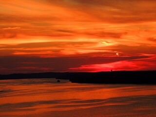 fiery sunset over the water in osage beach,  lake of the  ozarks, , missouri
