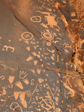 footprints  and symbols in the ancient native american newspaper rock petroglyphs near  canyonlands national park, utah