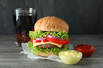 Concept of tasty food with delicious burger