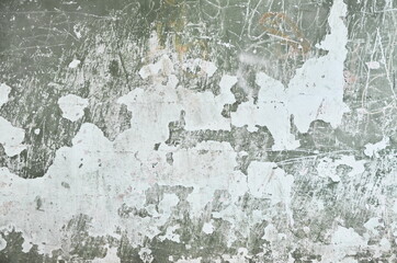 multi-colored scratched plaster. the effect of an old rubbed wall with cracks.