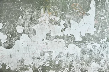 Foto op Plexiglas anti-reflex Verweerde muur veelkleurig gekrast gips. het effect van een oude gewreven muur met scheuren.