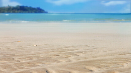 Fototapeta premium Soft sand on tropical beach and blue sea with summer sky.