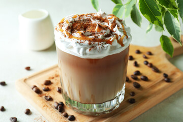 Concept of delicious drink with ice coffee on white textured table