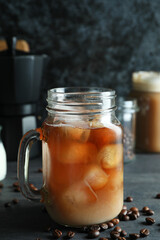 Concept of delicious drink with ice coffee on dark wooden table