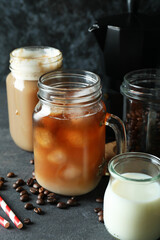 Concept of delicious drink with ice coffee on dark wooden table