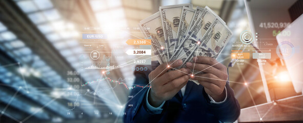 Businessman holding banknote and investment on business global network, and chart currency...