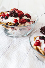 Granola with yogurt, strawberries, blackberries and blueberries