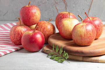 Delicious ripe red apples spread on the table.