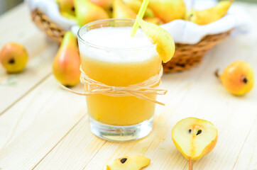 Pear Juice with fresh fruits on wooden boards